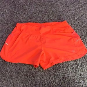 neon orange athleta shorts